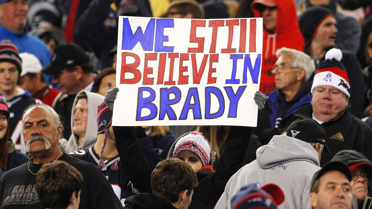 New England Patriots linebacker Tedy Bruschi and quarterback Tom Brady  watch the team warmups prior to their game against the New York Jets at  Gillette Stadium in Foxboro, MA on December 4