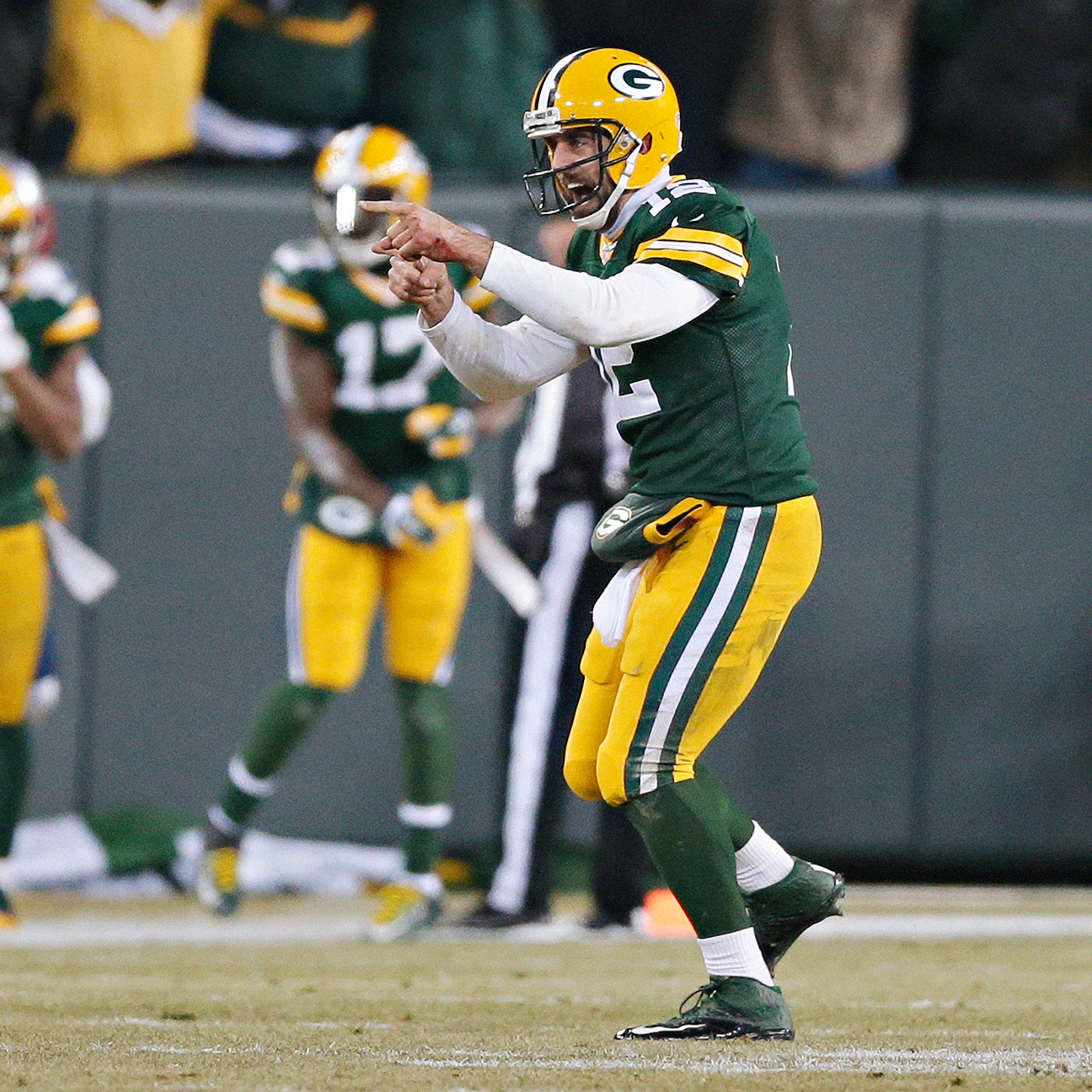 Green Bay Packers quarterback Aaron Rodgers runs off the field after the  game against the New England Patriots at Lambeau Field on November 30, 2014  in Green Bay, Wisconsin. The Packers defeated