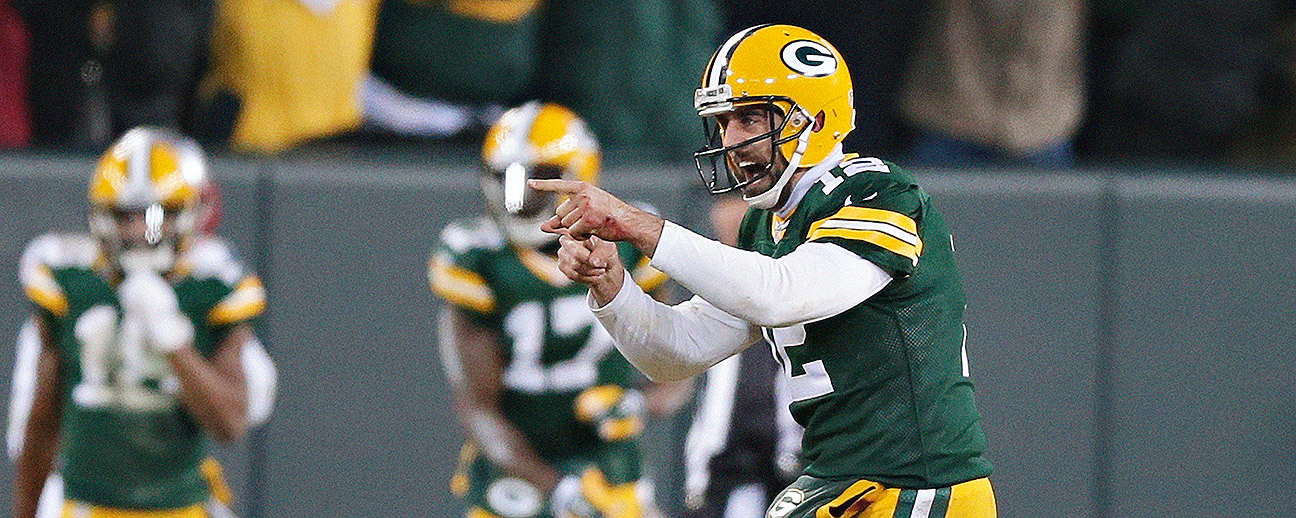 Green Bay Packers quarterback Aaron Rodgers runs off the field after the  game against the New England Patriots at Lambeau Field on November 30, 2014  in Green Bay, Wisconsin. The Packers defeated