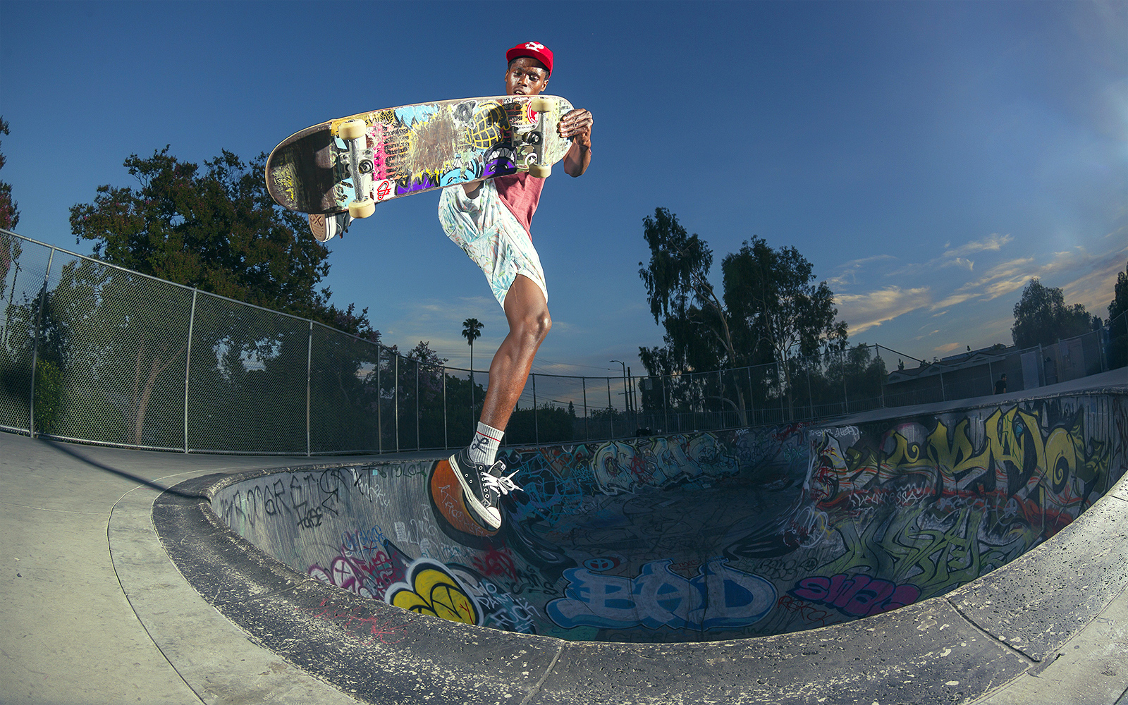 Skater Girl Grinding on a Ledge in a Outdoor Skatepark in Summer