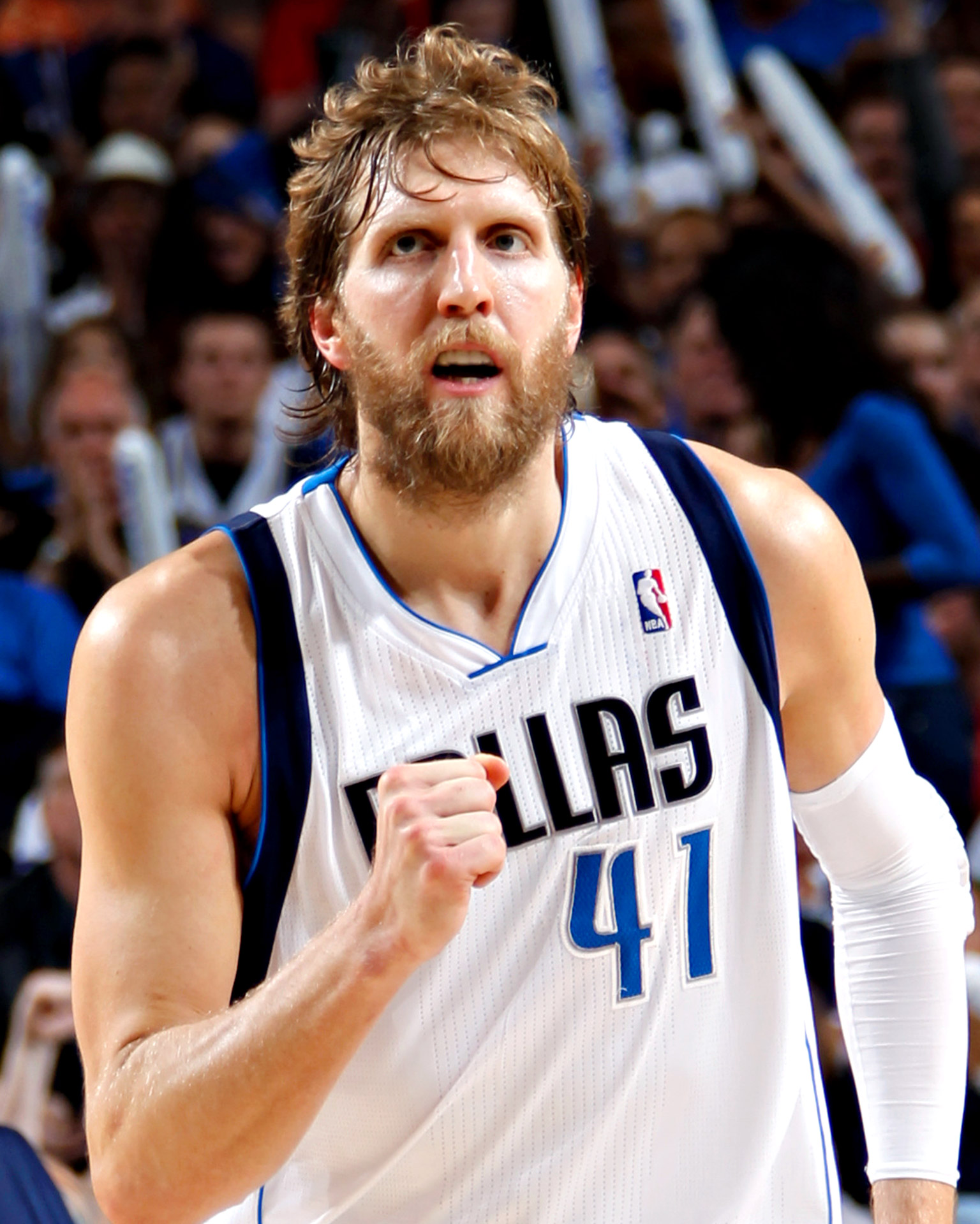 Dirk Nowitzki of the Dallas Mavericks brings the ball up the court against ...