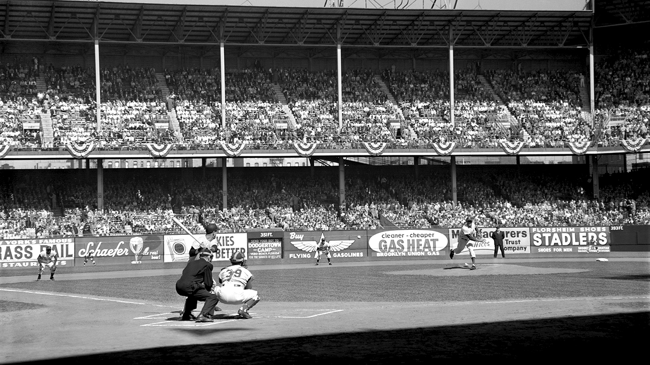 Brooklyn Dodger PeeWee Reese warms up before the game