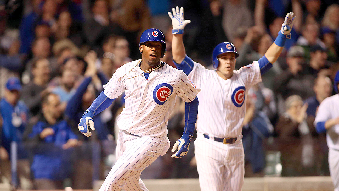 Images: Soler homers twice, Cubs win 7-6 over Reds in 10 innings