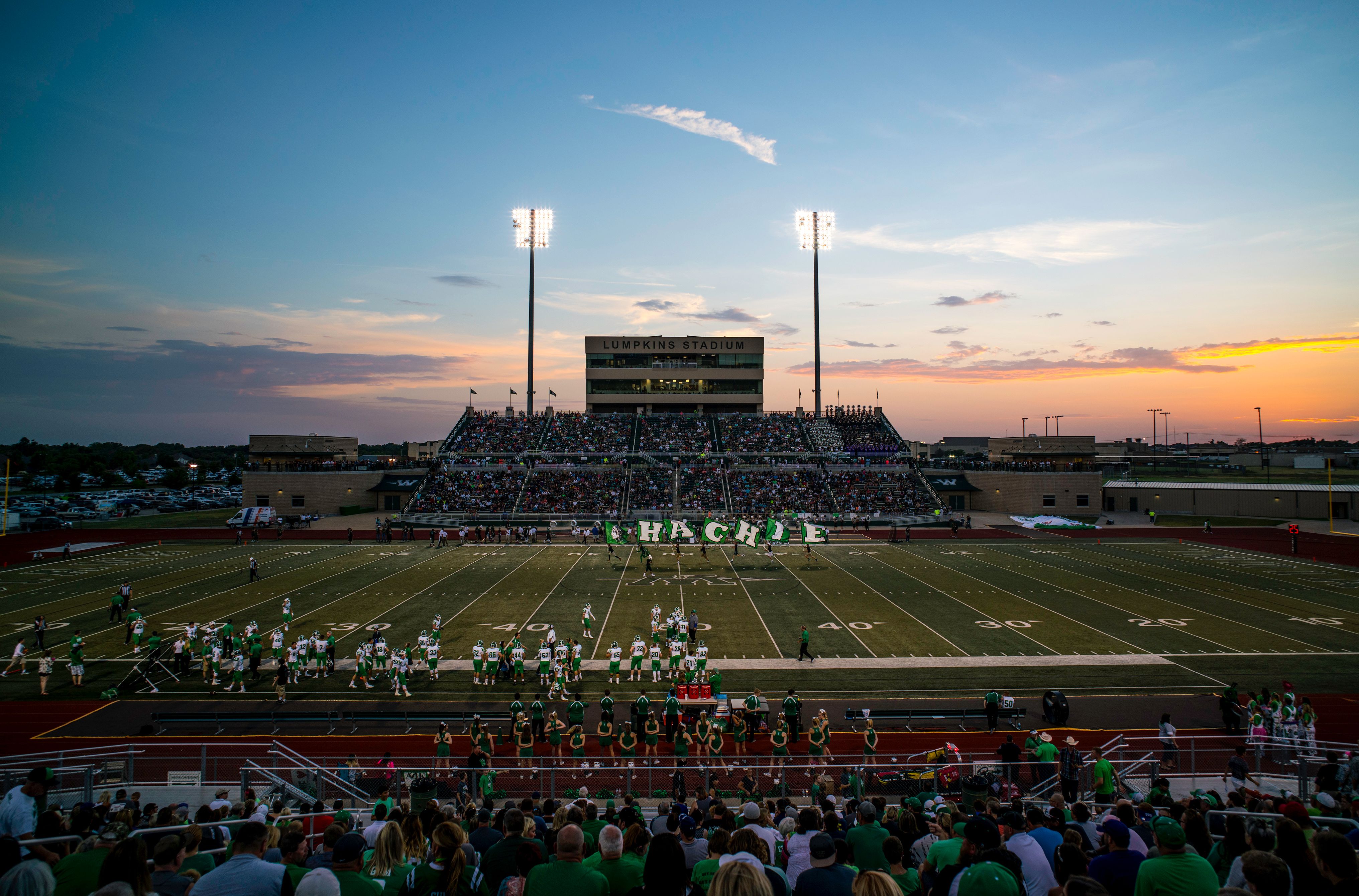 Lumpkins Stadium on game night Photos Jon Kitna, Head Football Coach