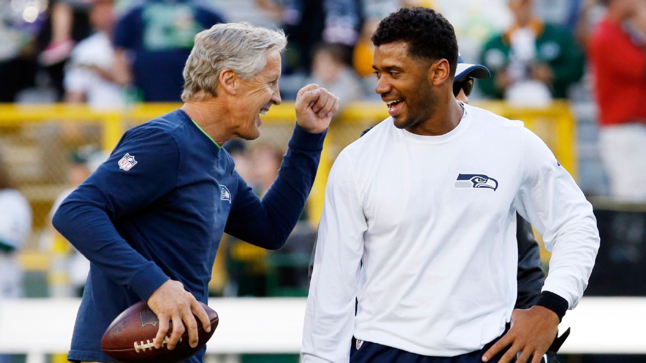 Russell Wilson does Pete Carroll for Halloween -- wig, gum and all