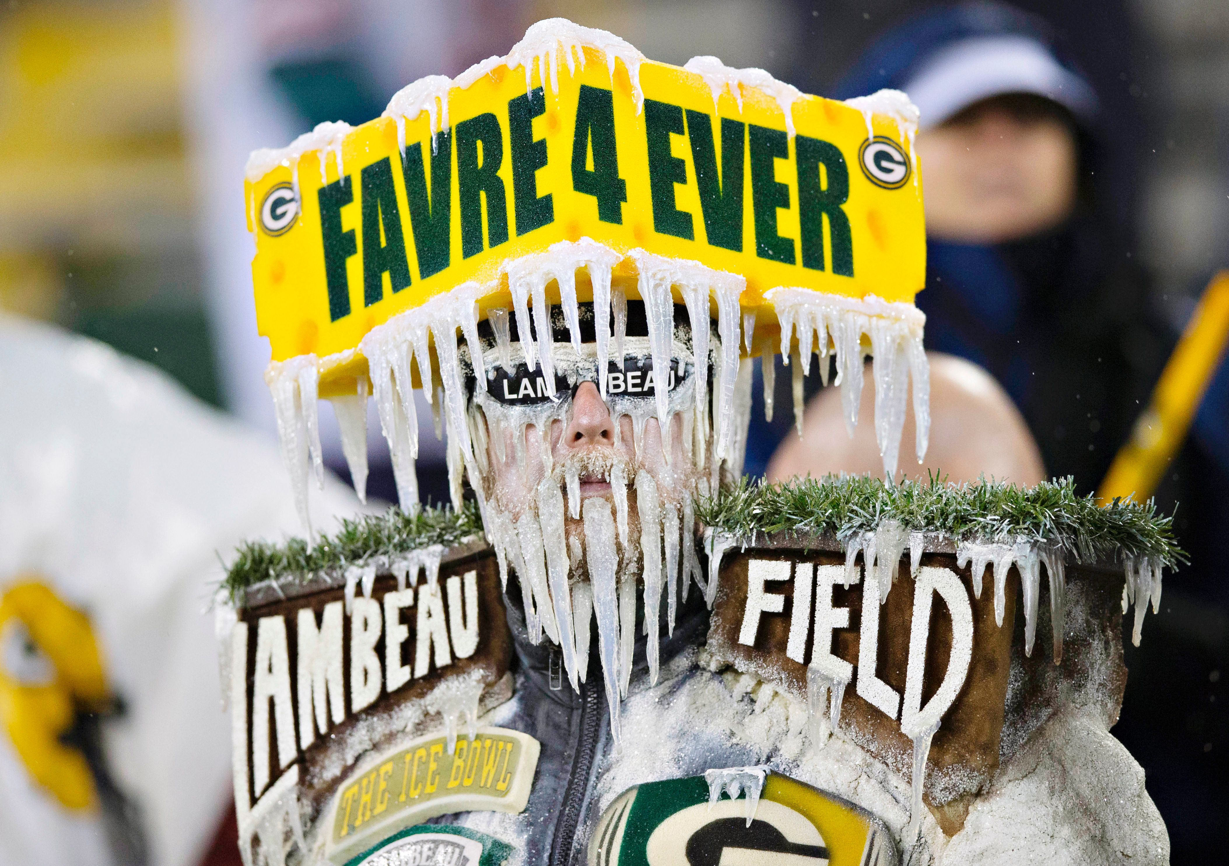 Green Bay Packers fan, Frozen Tundra Man looks on during the