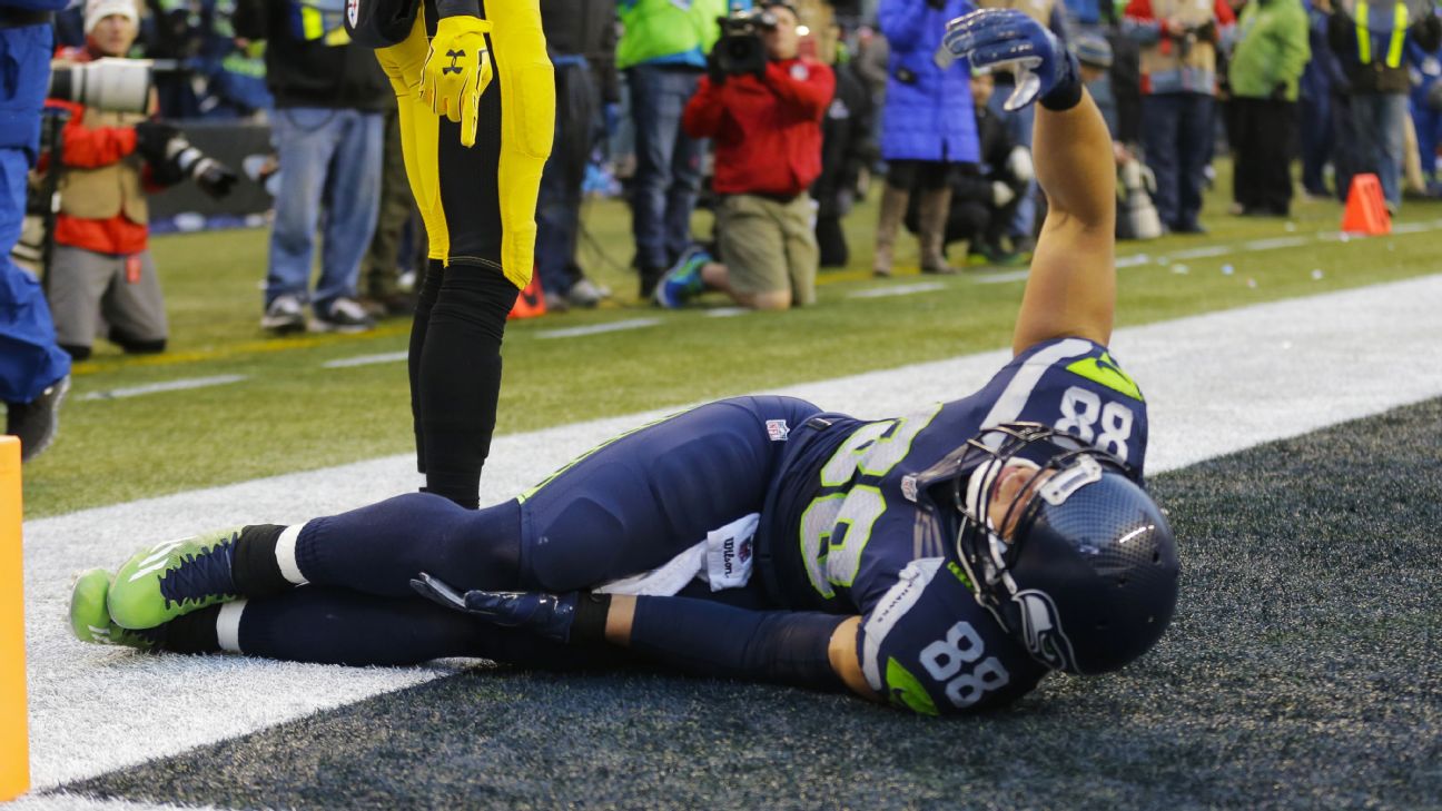 Jimmy Graham of the Seattle Seahawks watches from the sideline during