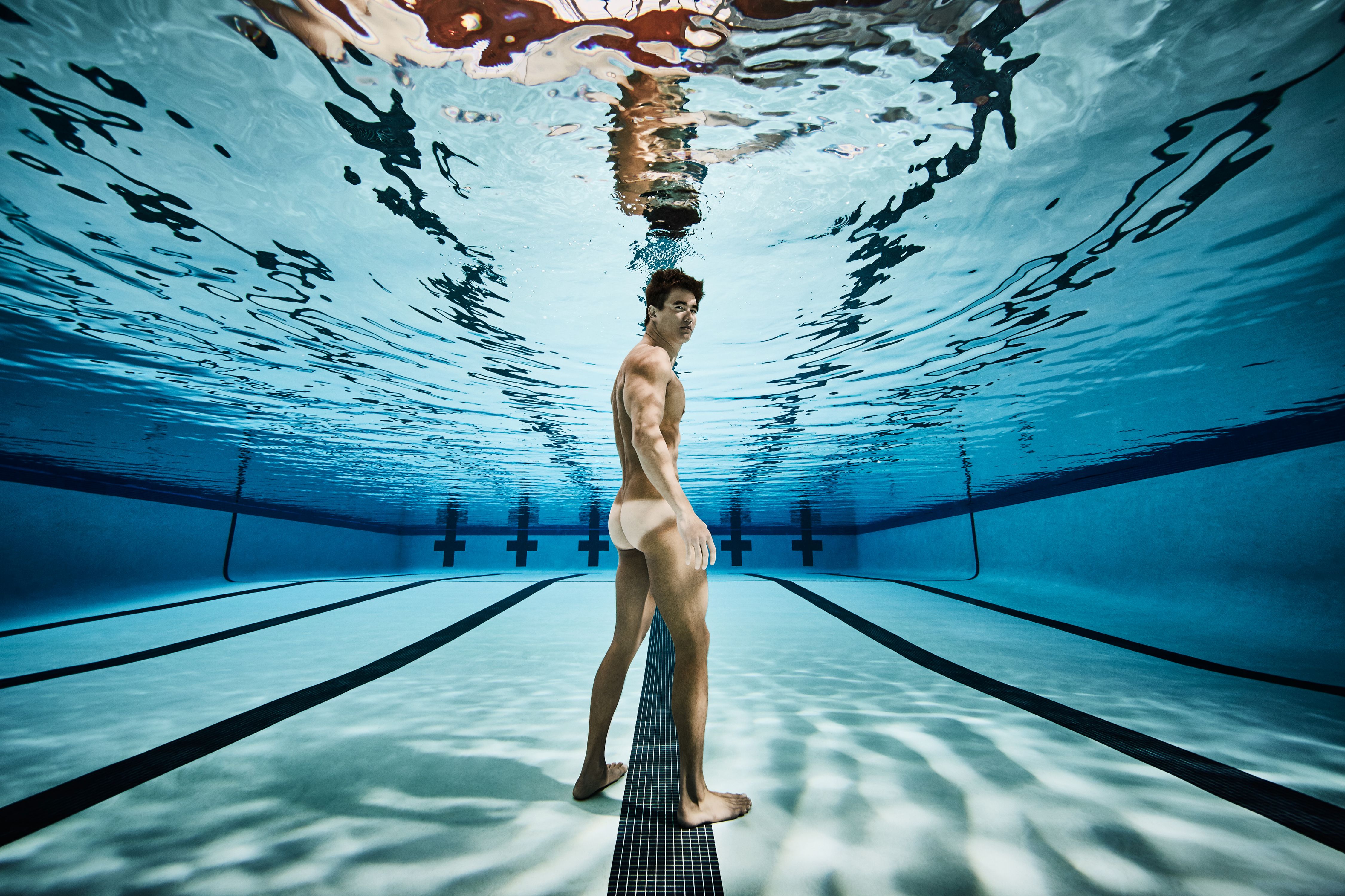 Nude male swimmers.