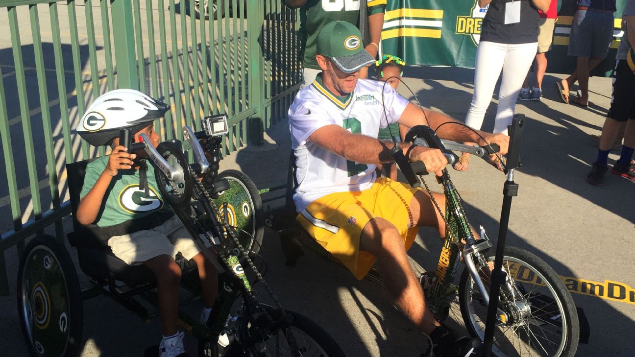 Big guys on bikes: Packers ride to training camp