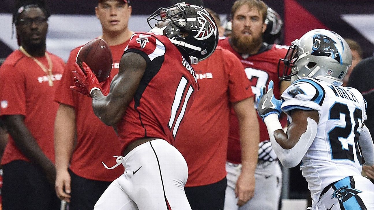 PHOTO: Falcons QB Matt Ryan shows off his Luke Kuechly Panthers jersey 