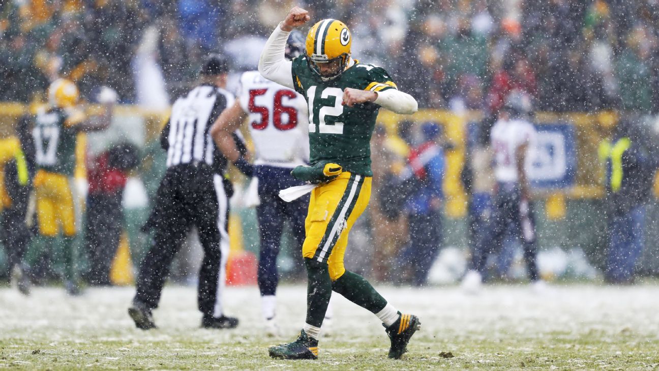 Green Bay Packers' Randall Cobb makes snow angel in end zone