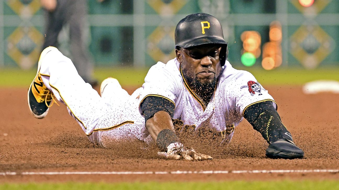 Pittsburgh Pirates' Starling Marte, left, hitches a ride to the