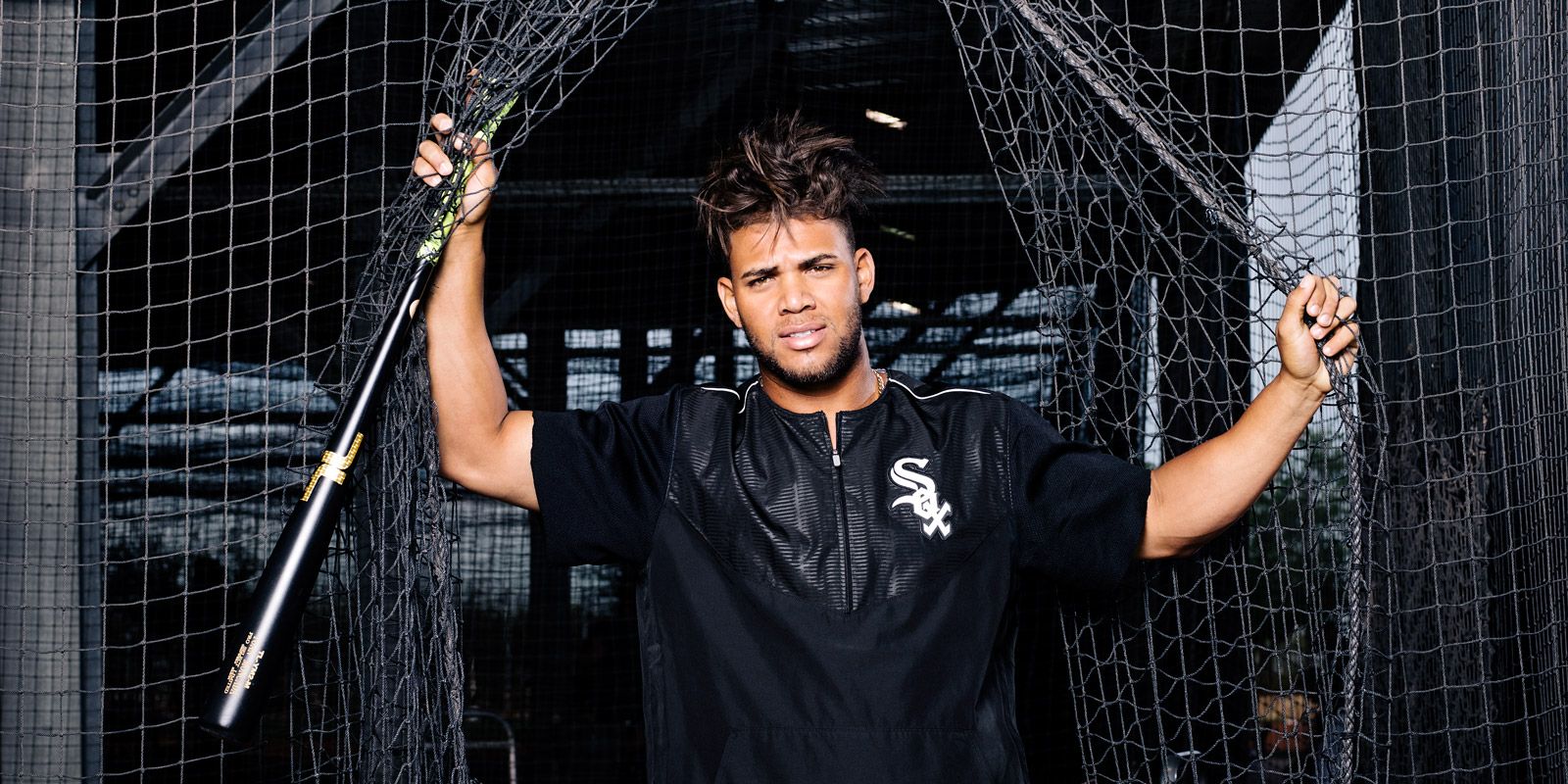 A tattoo is seen on Chicago White Sox Yoan Moncada's neck during