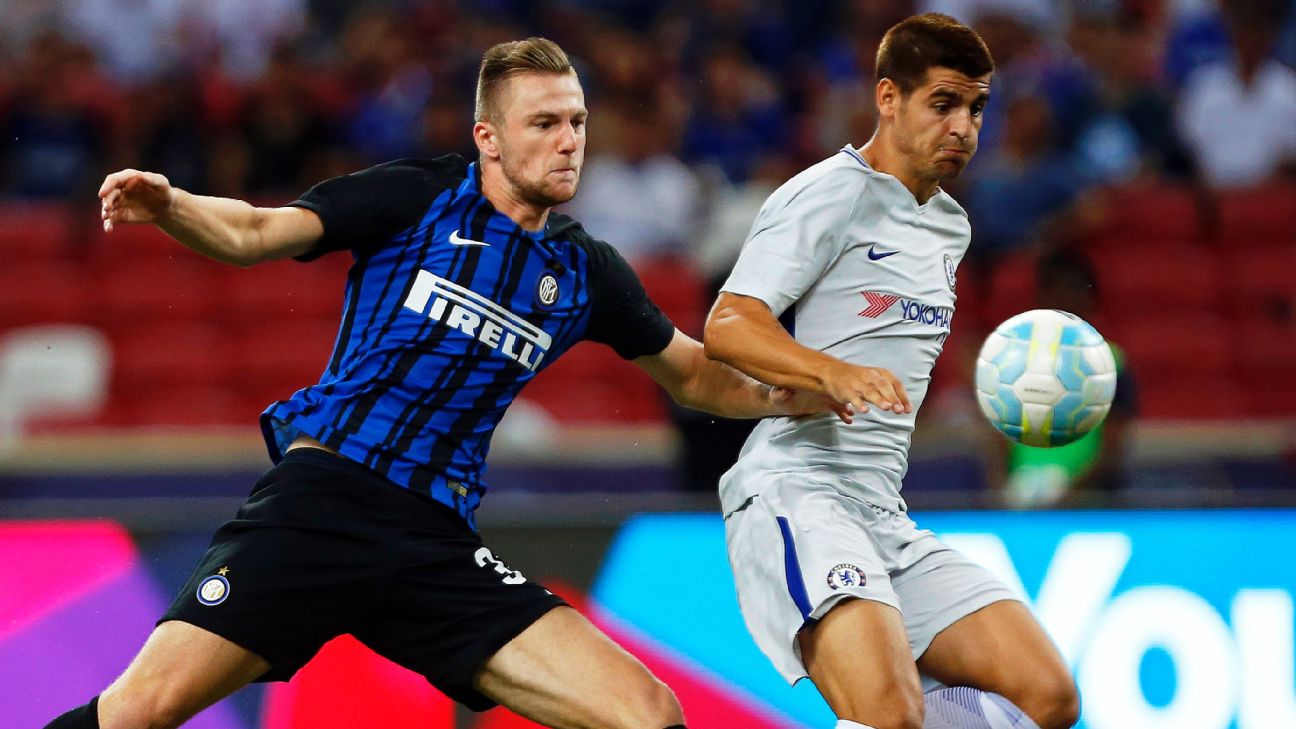 Inter Milan defender Andrea Ranocchia, right, challenges AC Milan