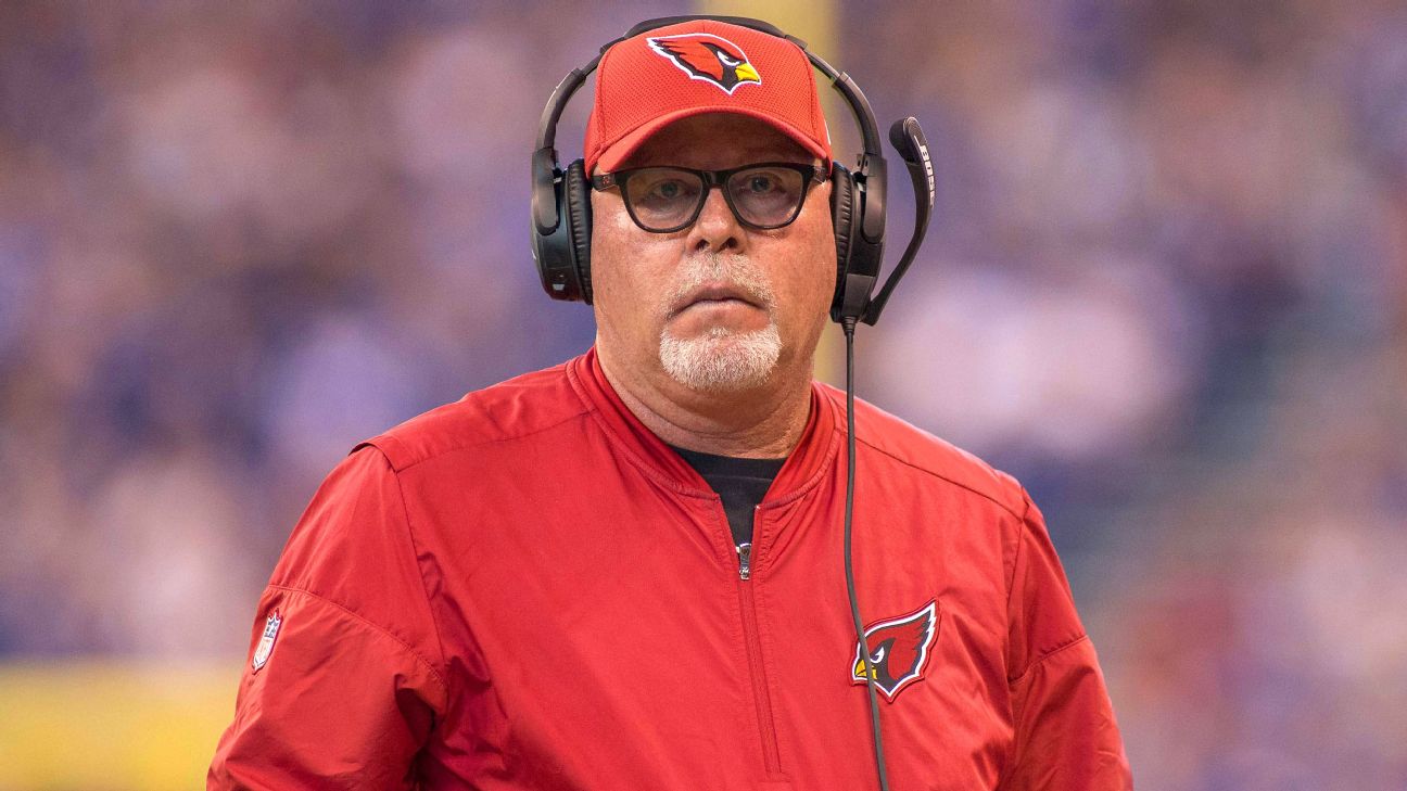 A 9/11 memorial pin is seen on the cap of Arizona Cardinals head coach Bruce  Arians prior to an NFL football game against the New England Patriots,  Sunday, Sept. 11, 2016, in