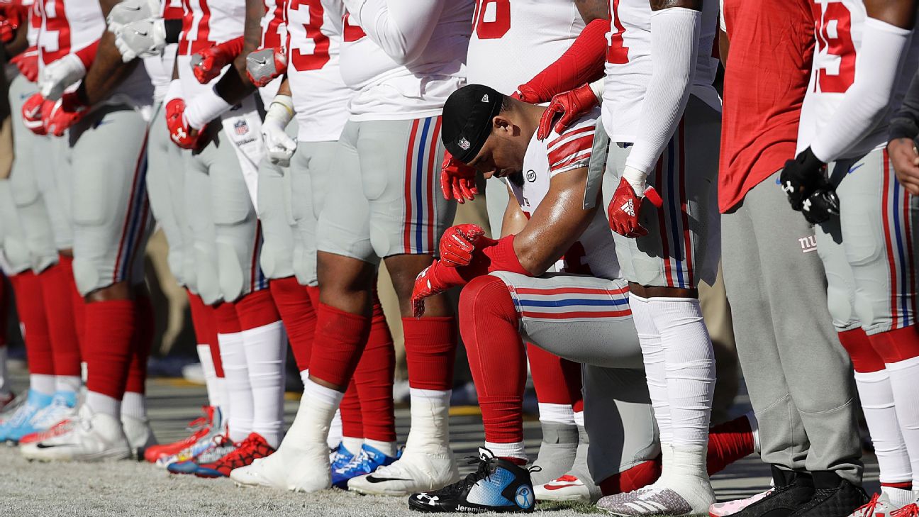 Raiders RB Marshawn Lynch sits during anthem before Rams game