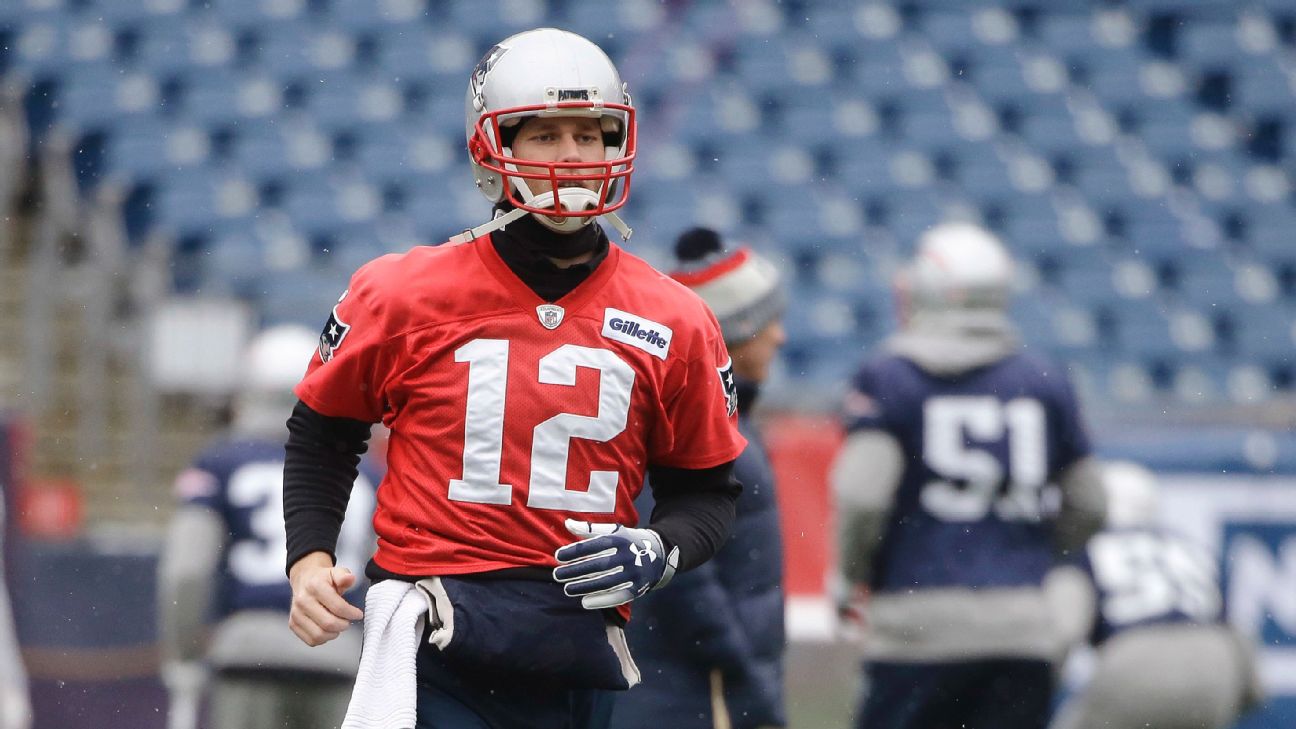 New England Patriots' Tom Brady (12) and Brian Hoyer (2) warm up before the  NFL Super