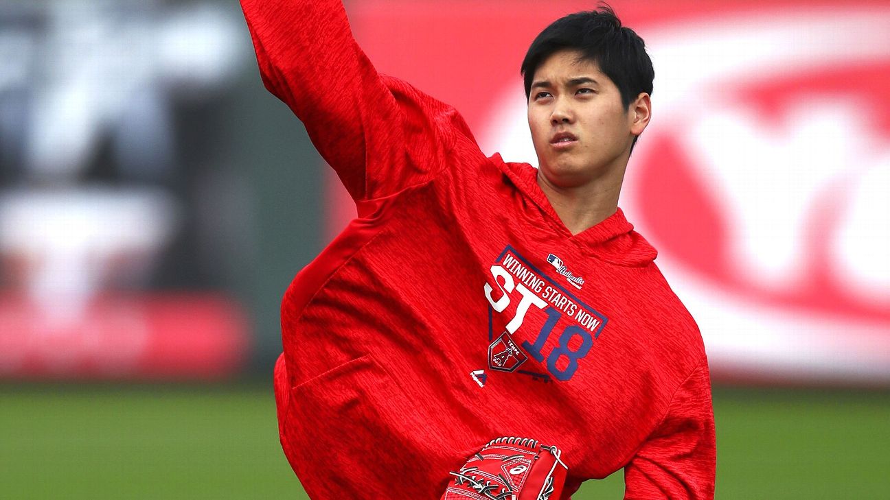 Ohtani reports to Angels with physical, swings and long toss