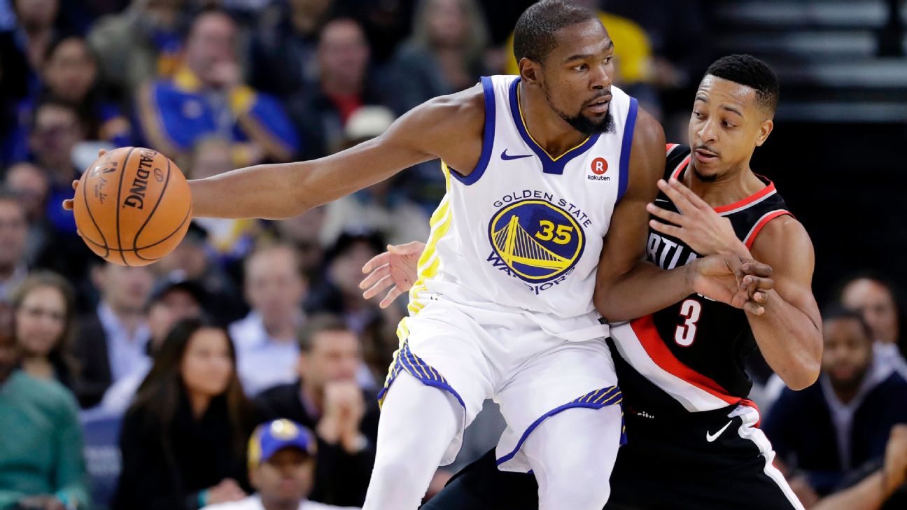 Portland Trail Blazers' CJ McCollum tries to defend against Golden State  Warriors' g/30/ in the first quarter during game 2 of the Western  Conference Finals between the Golden State Warriors and the