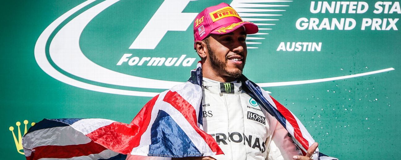 Mercedes driver Lewis Hamilton (44) of Great Britain drapes flag of Great Britain over his shoulders after winning the Formula 1 United States Grand Prix.