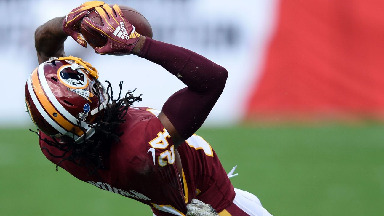 Washington Redskins' newly signed cornerback Josh Norman listens