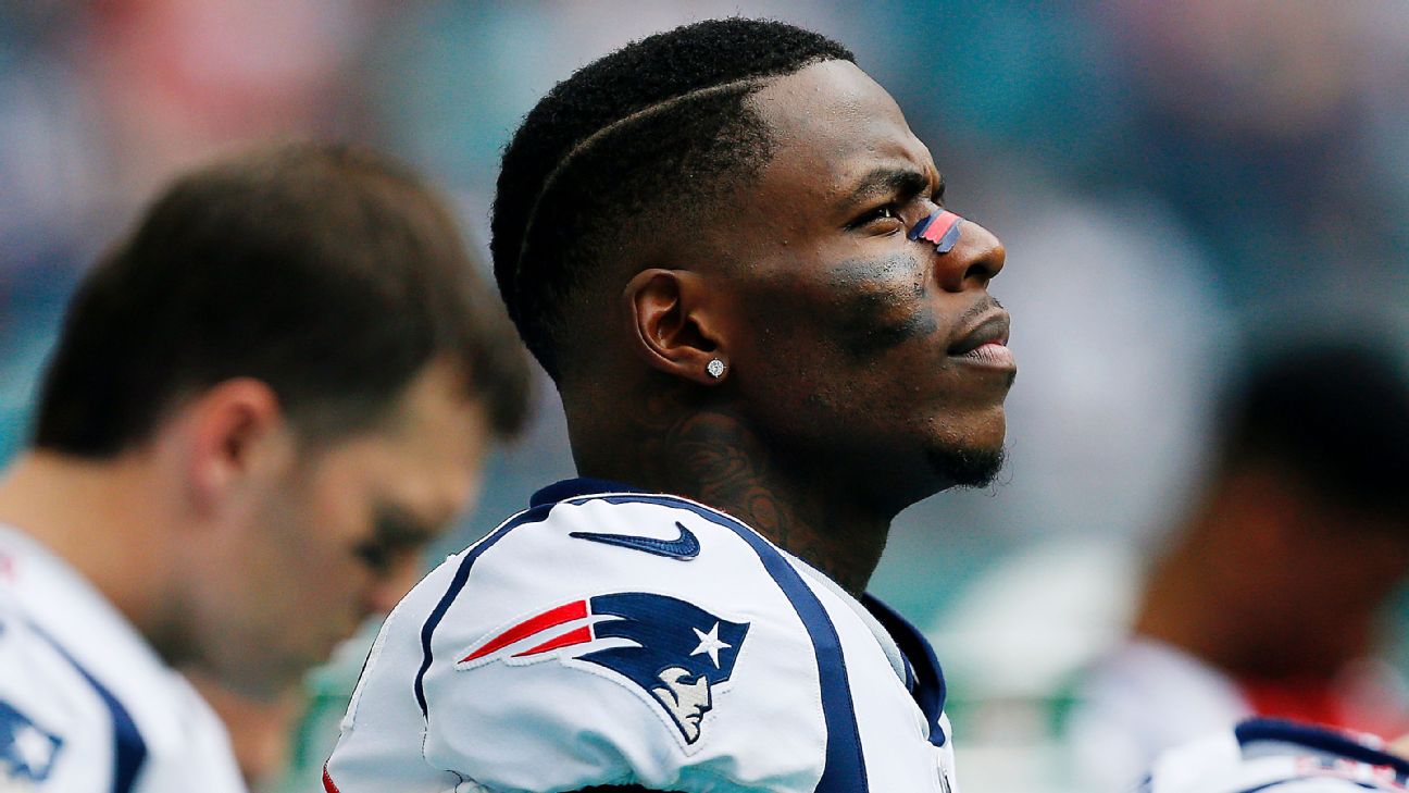 A fan wears a jersey with the name of New England Patriots wide receiver Josh  Gordon as he arrives at Gillette Stadium for an NFL football game between  the Patriots and the