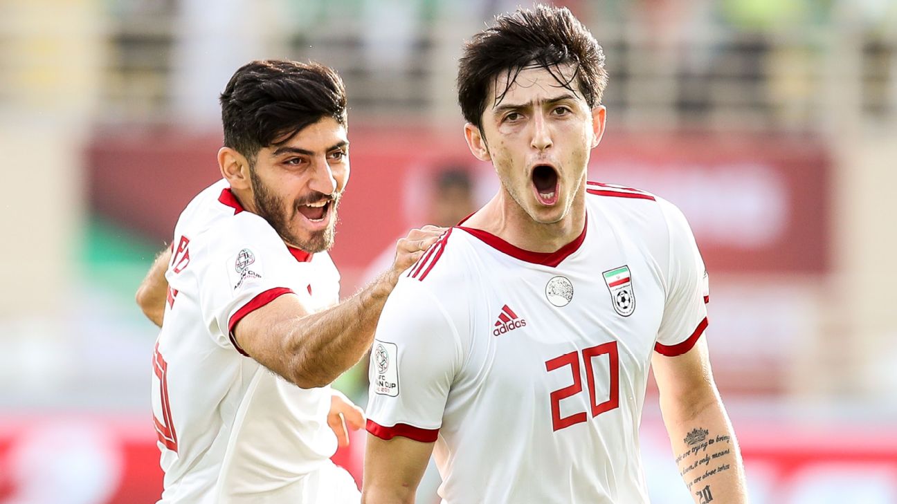 Sardar Azmoun double helps Iran into