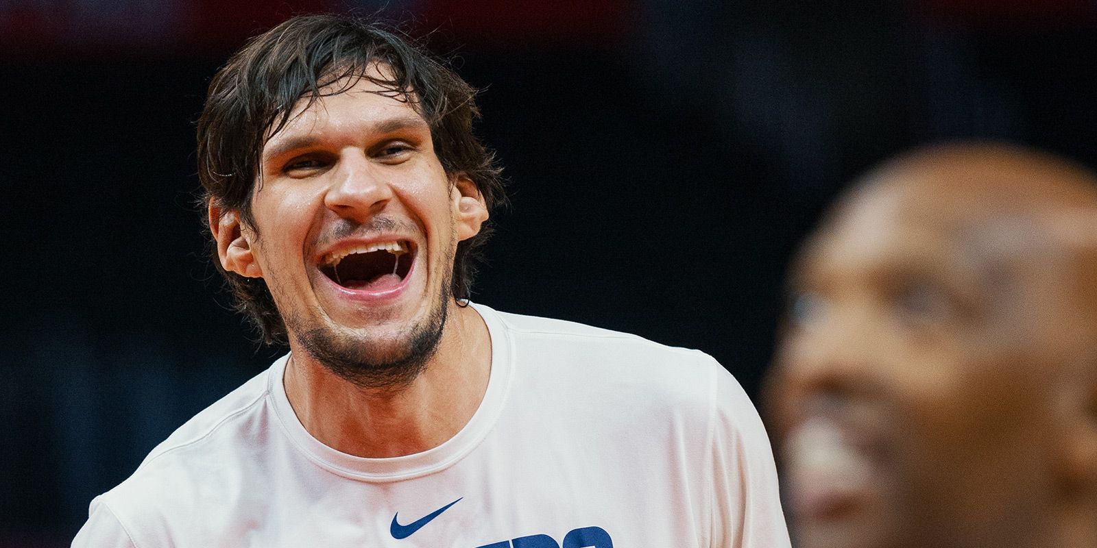 Dallas Mavericks' Boban Marjanovic shakes hands with a fan prior