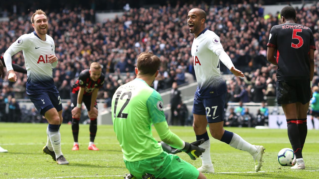 Lucas Moura of Tottenham celebrates scoring their 2nd goal while Huddersfield goalkeeper Ben Hamer looks dejected 