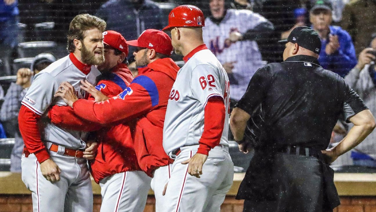 Phillies' Bryce Harper ejected after charging at Rockies' dugout - ESPN