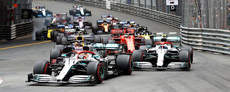 Lewis Hamilton leads the pack through Turn 1 at the Monaco Grand Prix.