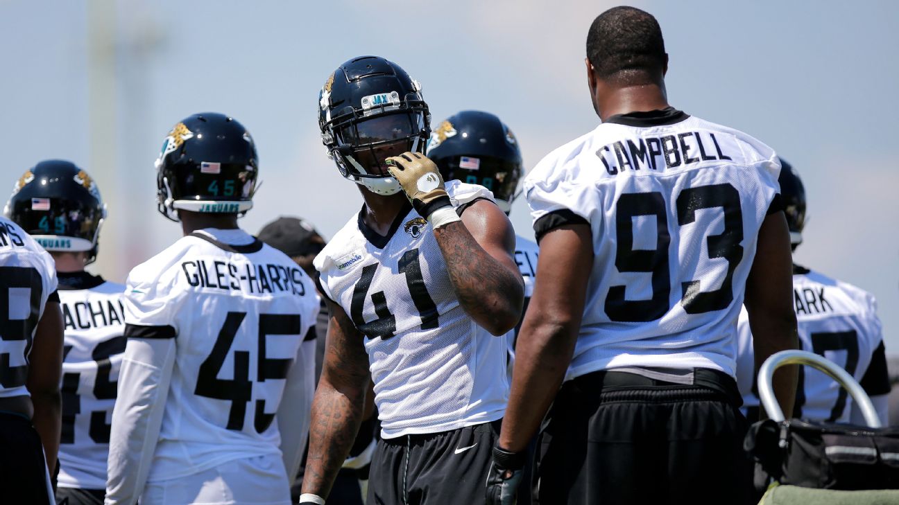 Jaguars' defensive end Josh Allen squishes the Miami Dolphins