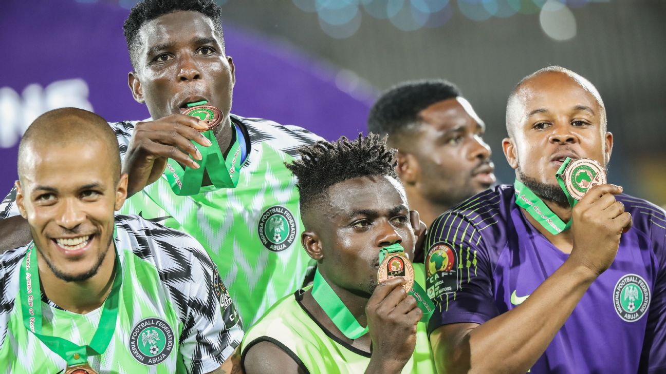 Nigeria players celebrate after winning the Africa Cup of Nations third-place game against Tunisia. Nigeria players celebrate after winning the Africa Cup of Nations third-place game against Tunisia.