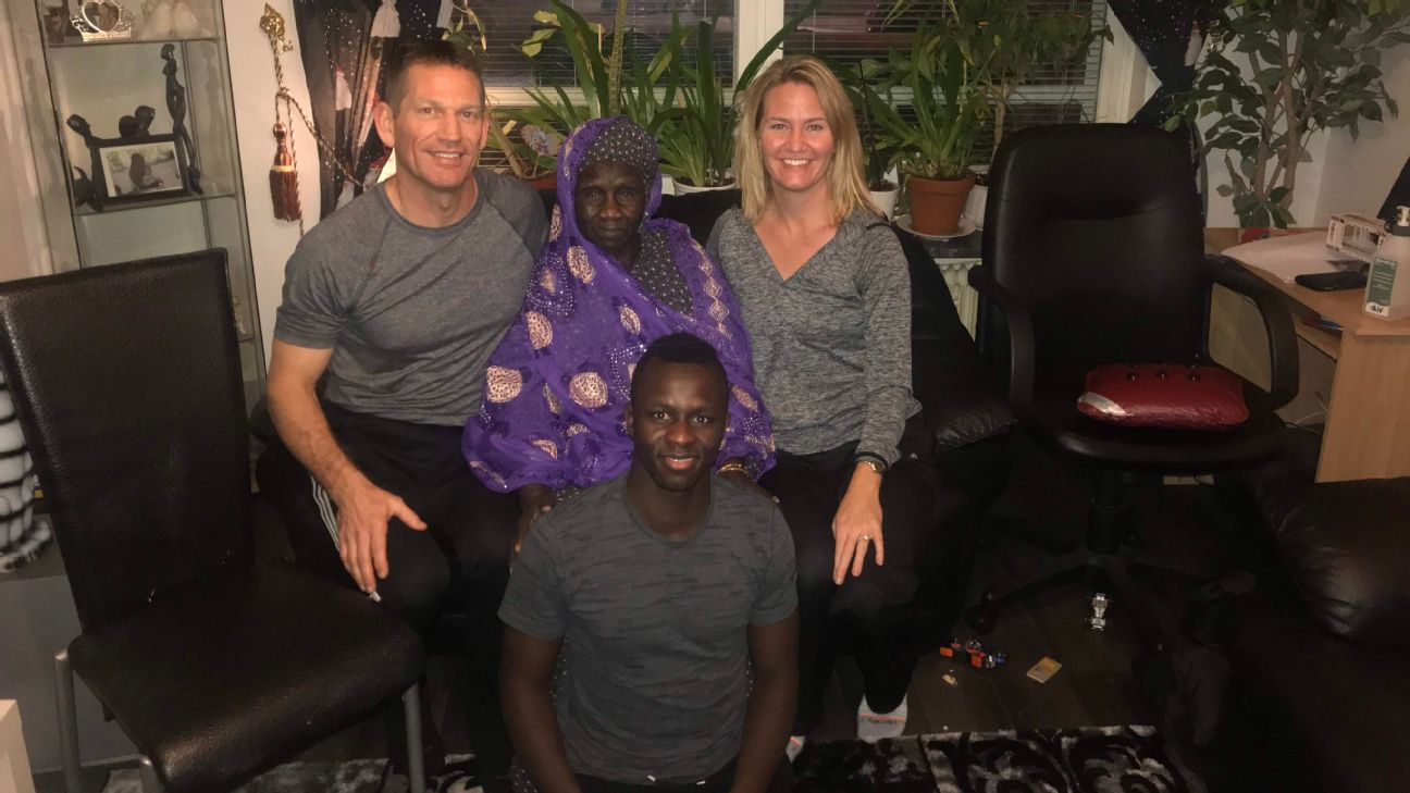 Kekuta Manneh poses with his father Eric Niccum, his grandmother, and his mother LaRhonda Niccum. Kekuta Manneh poses with his father Eric Niccum, his grandmother, and his mother LaRhonda Niccum.