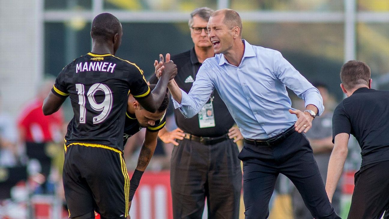 Kekuta Manneh and Gregg Berhalter celebrate during the Columbus Crew's MLS match against the Chicago Fire. Kekuta Manneh and Gregg Berhalter celebrate during the Columbus Crew's MLS match against the Chicago Fire.