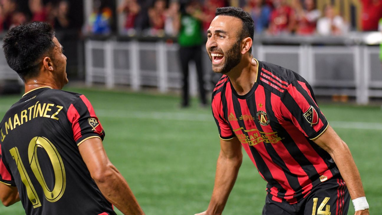 Atlanta United players Justin Meram, right, and Atlanta United players Justin Meram, right, and