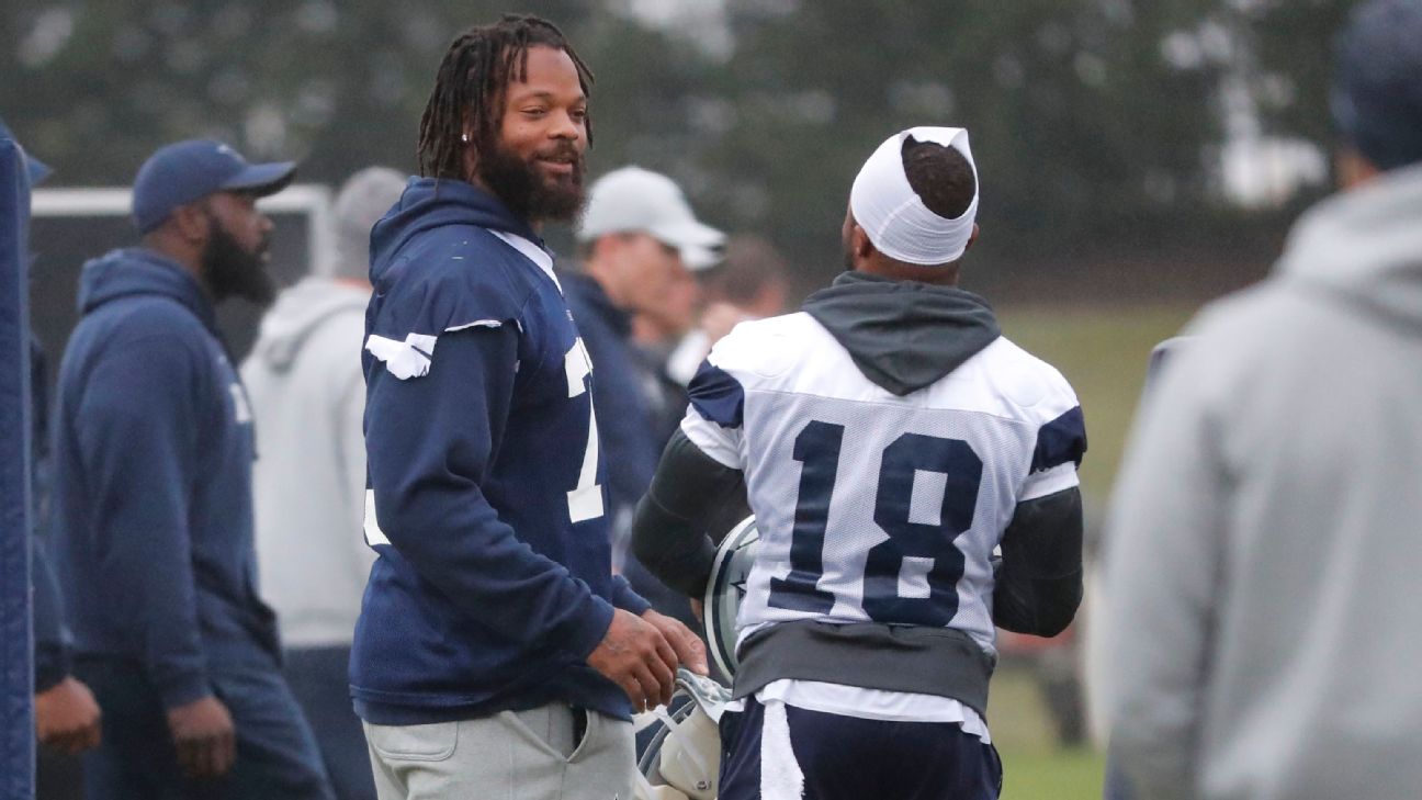 Michael Bennett, all Seahawks, stand for the national anthem on Salute to  Service night vs. Atlanta