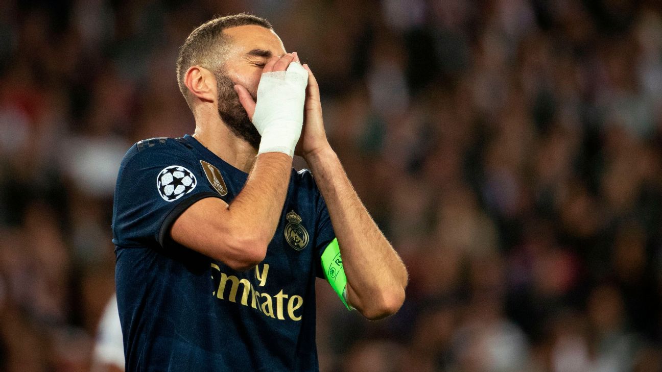 Karim Benzema reacts during Real Madrid's Champions League loss to Paris Saint-Germain.