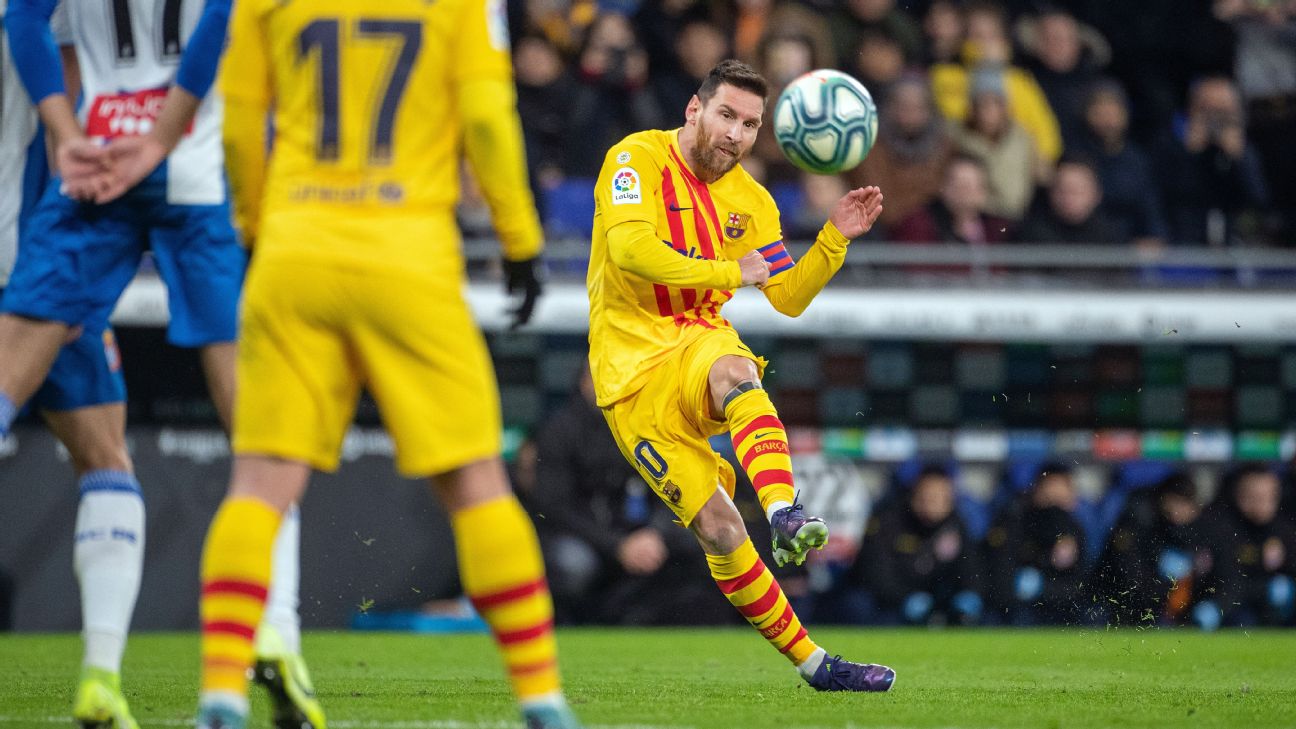 Lionel Messi strikes the ball during Barcelona's La Liga match against Espanyol.