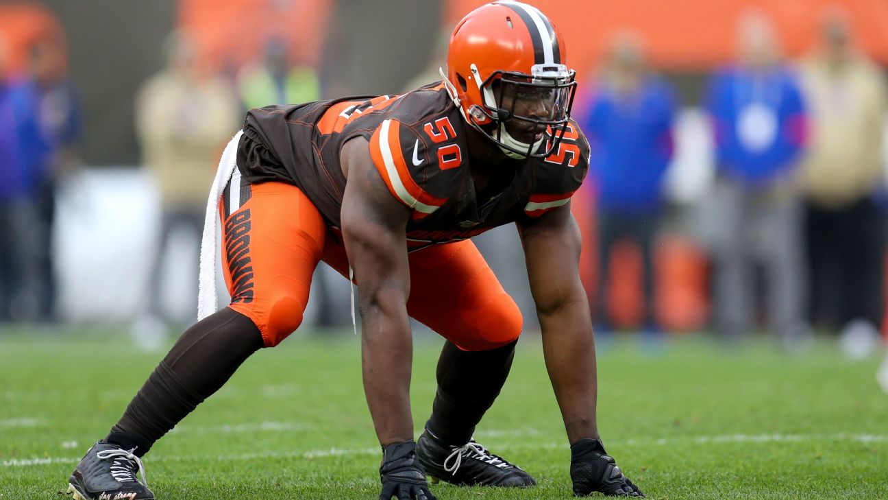 FILE - In this Aug. 8, 2019, file photo, Cleveland Browns defensive end  Chris Smith (50) sits on the sideline during the first half of an NFL  preseason football game against the