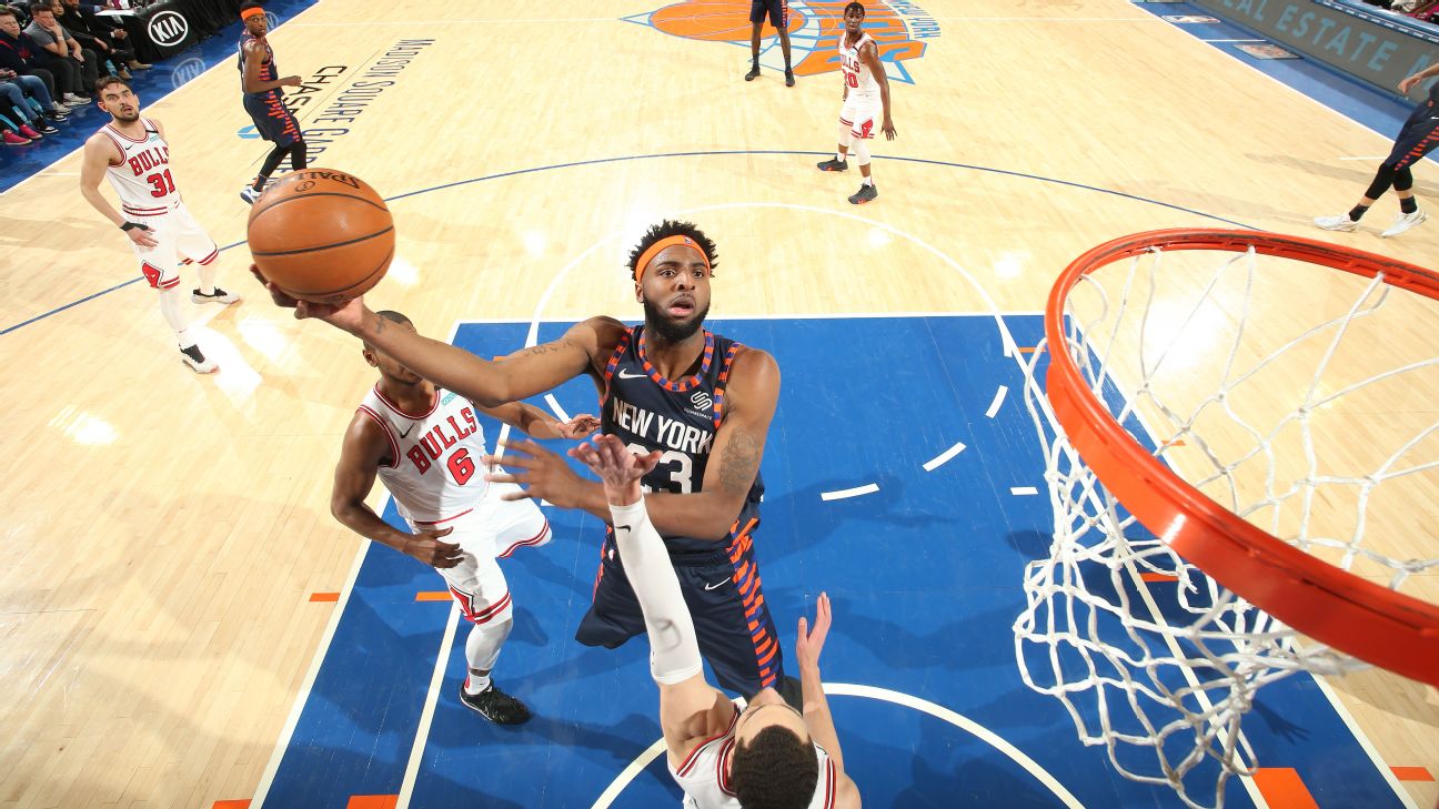 New York Knicks center Mitchell Robinson (23) grabs a rebound over