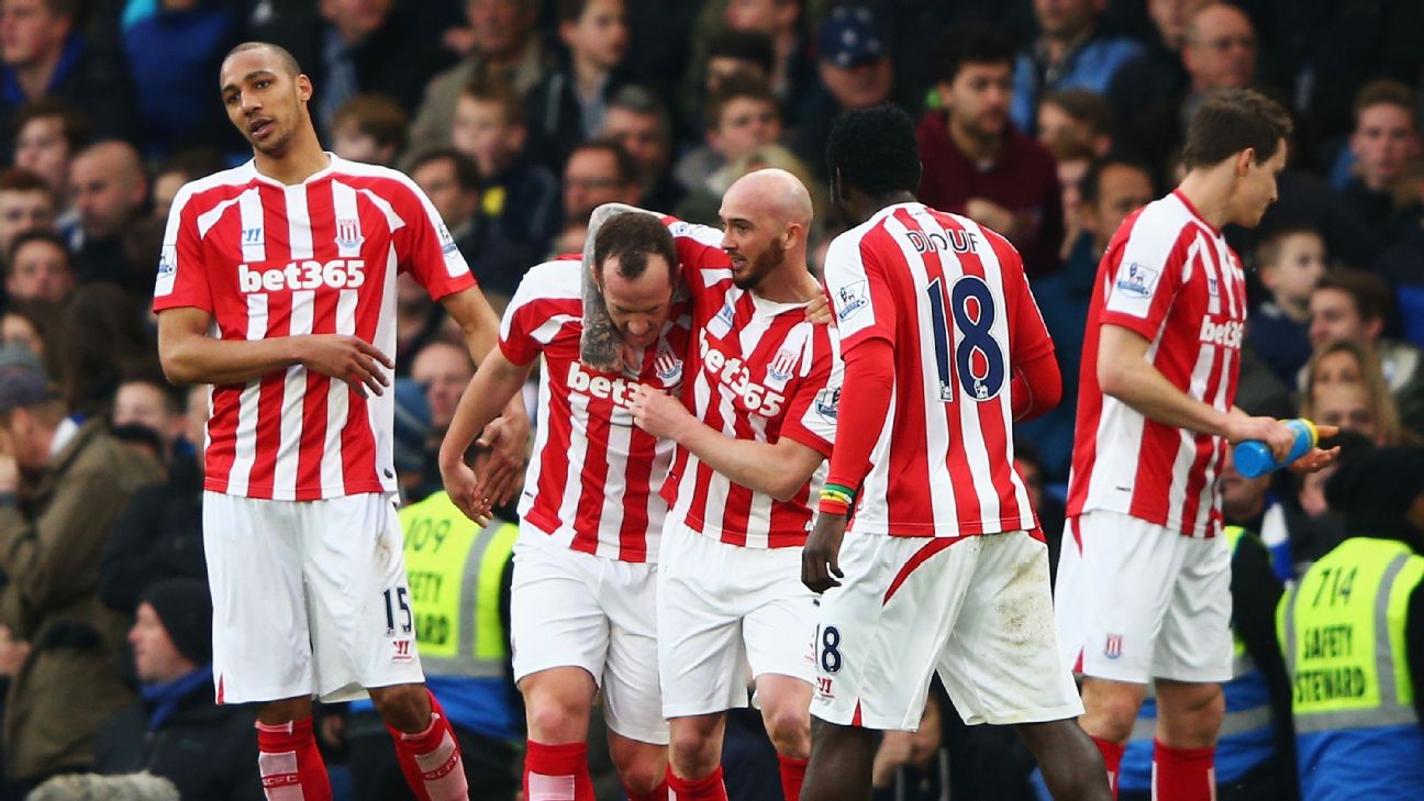 Charlie Adam of Stoke City celebrates with teammates after scoring a screamer against Chelsea in 2015.