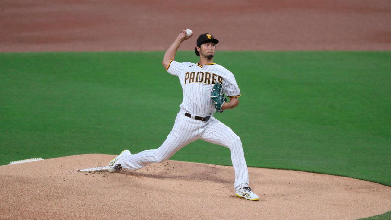 San Diego Padres starting pitcher Yu Darvish, left, leaves the