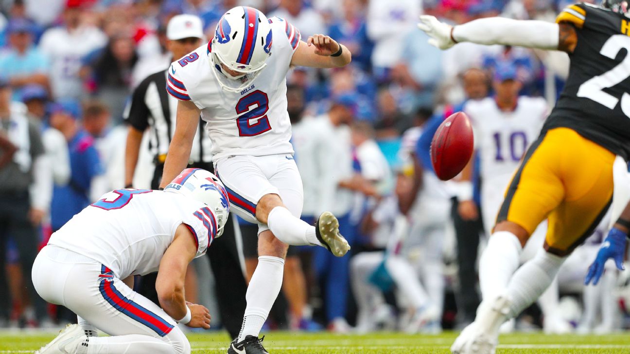 Tyler Bass of the Buffalo Bills kicks a field goal as Sam Martin