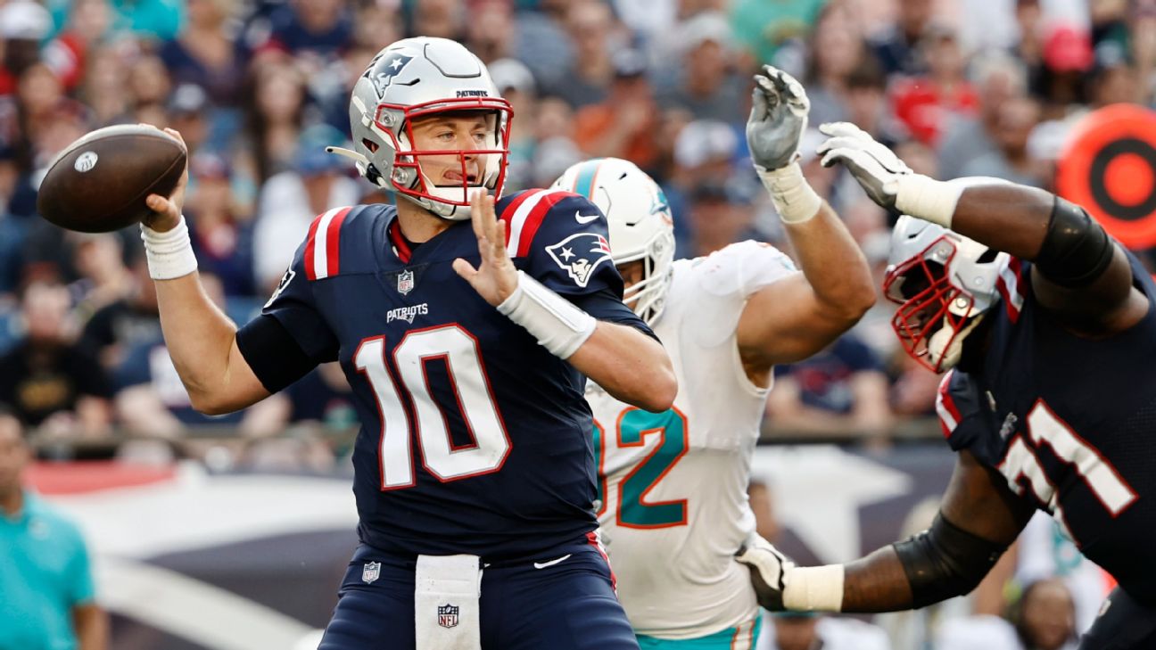 New England Patriots wide receiver Nelson Agholor (15) heads for the end  zone after a touchdown pass from New England Patriots quarterback Mac Jones  during the first half of an NFL football