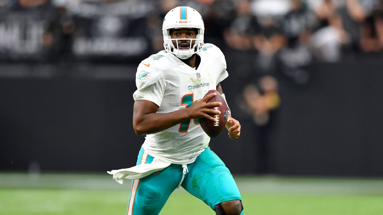 Miami Dolphins quarterback Jacoby Brissett (14) walks the sidelines during  the first half of an NFL football game against the New York Jets, Sunday,  Dec. 19, 2021, in Miami Gardens, Fla. (AP