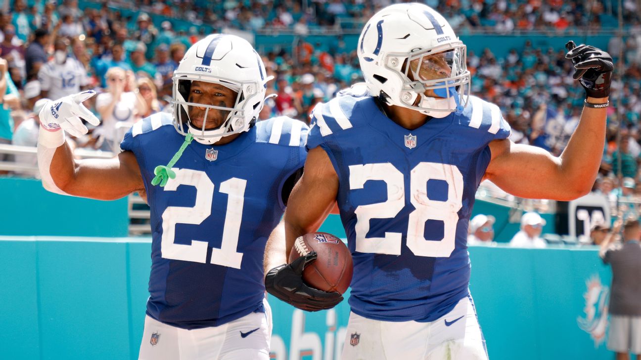 Indianapolis Colts' Nyheim Hines, left, and Jacksonville Jaguars