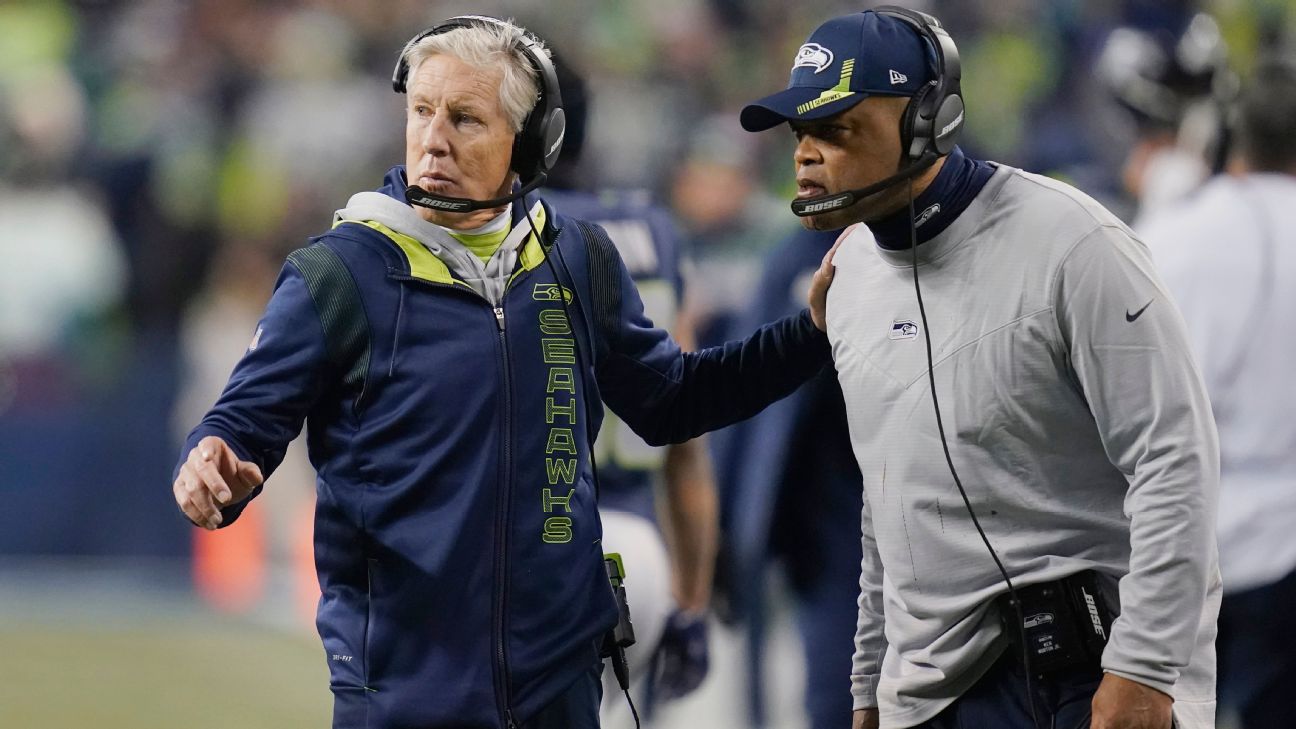 Seattle Seahawks head coach Pete Carroll, center, huddle with defensive  coordinator Ken Norton and defensive captain, Seattle Seahawks middle  linebacker Bobby Wagner (54) during the fourth quarter against the Arizona  Cardinals at