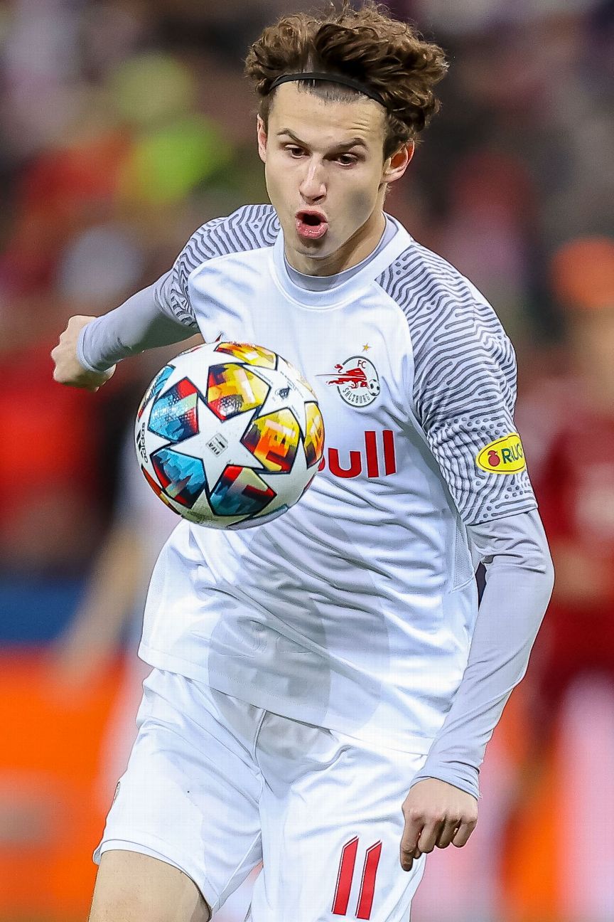 Leipzig's Benjamin Sesko, top, heads the ball during the German