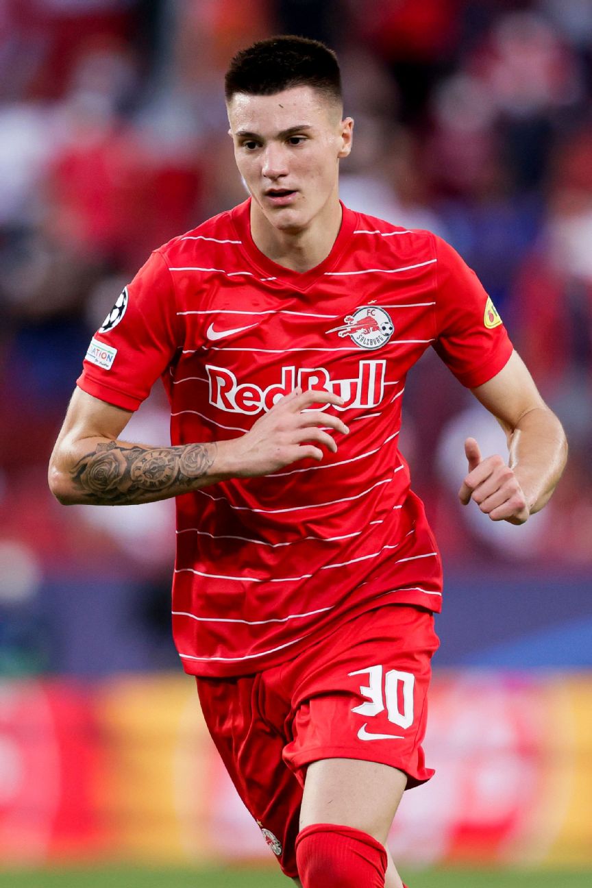 Leipzig's Benjamin Sesko, top, heads the ball during the German